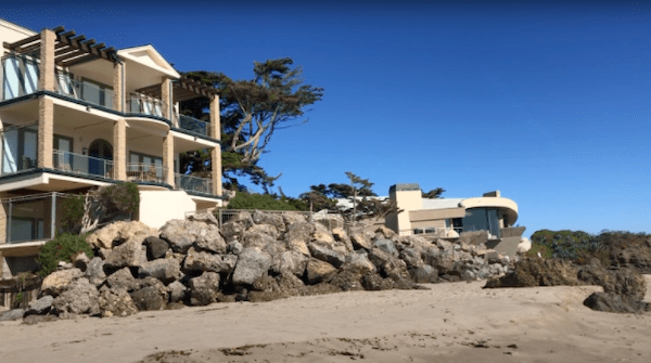 A rock wall wards off waves in front of a Malibu mansion on Broad Beach. Photo by Jenna Gaertner and Brianna Willis