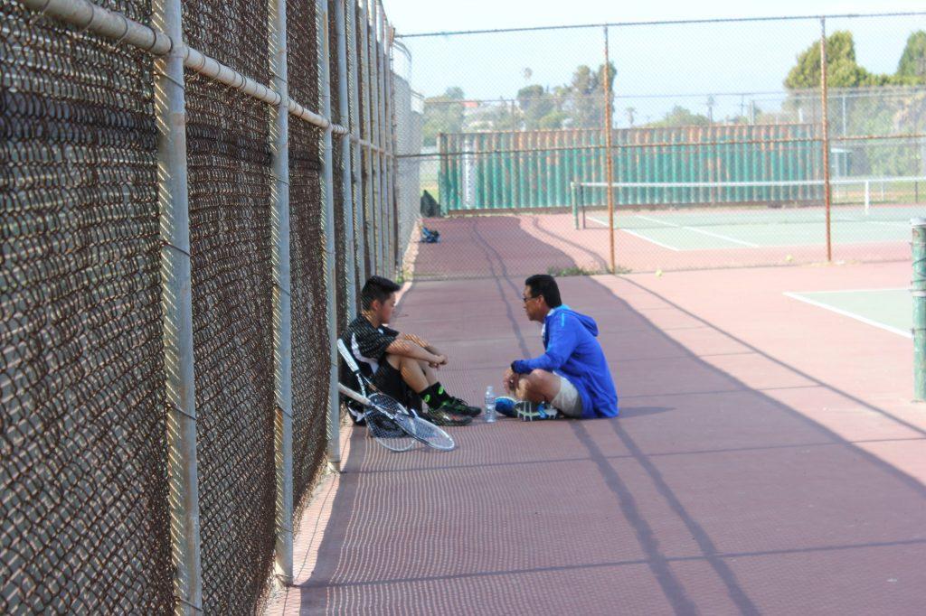 Justin&squot;s father takes a moment to teach him a lesson while on the tennis court. "It was such a powerful moment of coaching and fatherly love to me," Chai said.