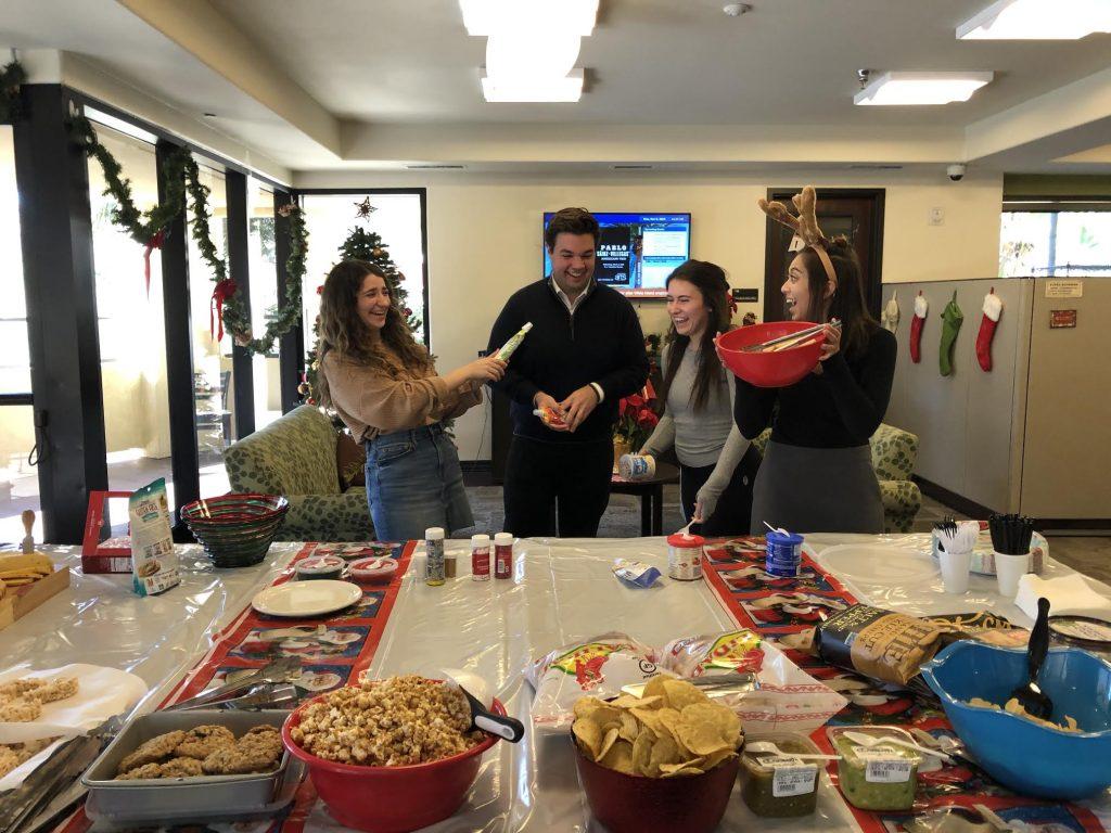 From left to right, Elise Sanchez, Jared Maguire, Lizzy Kovach and Sabrina Willsion celebrate the holidays at the Inter-Club Council holiday party. He said he made many meaningful friendships while being a part of ICC over the years.