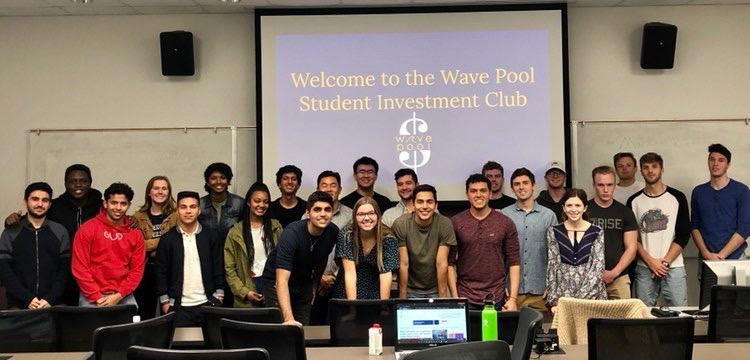 Members of the Wave Pool: Student Investment Club, which senior Jorge Contreras leads, smile for a group photo at one of their meetings. The Wave Pool sought a way to promote financial literacy and extend career opportunities in finance. Photo courtesy of Jorge Contreras