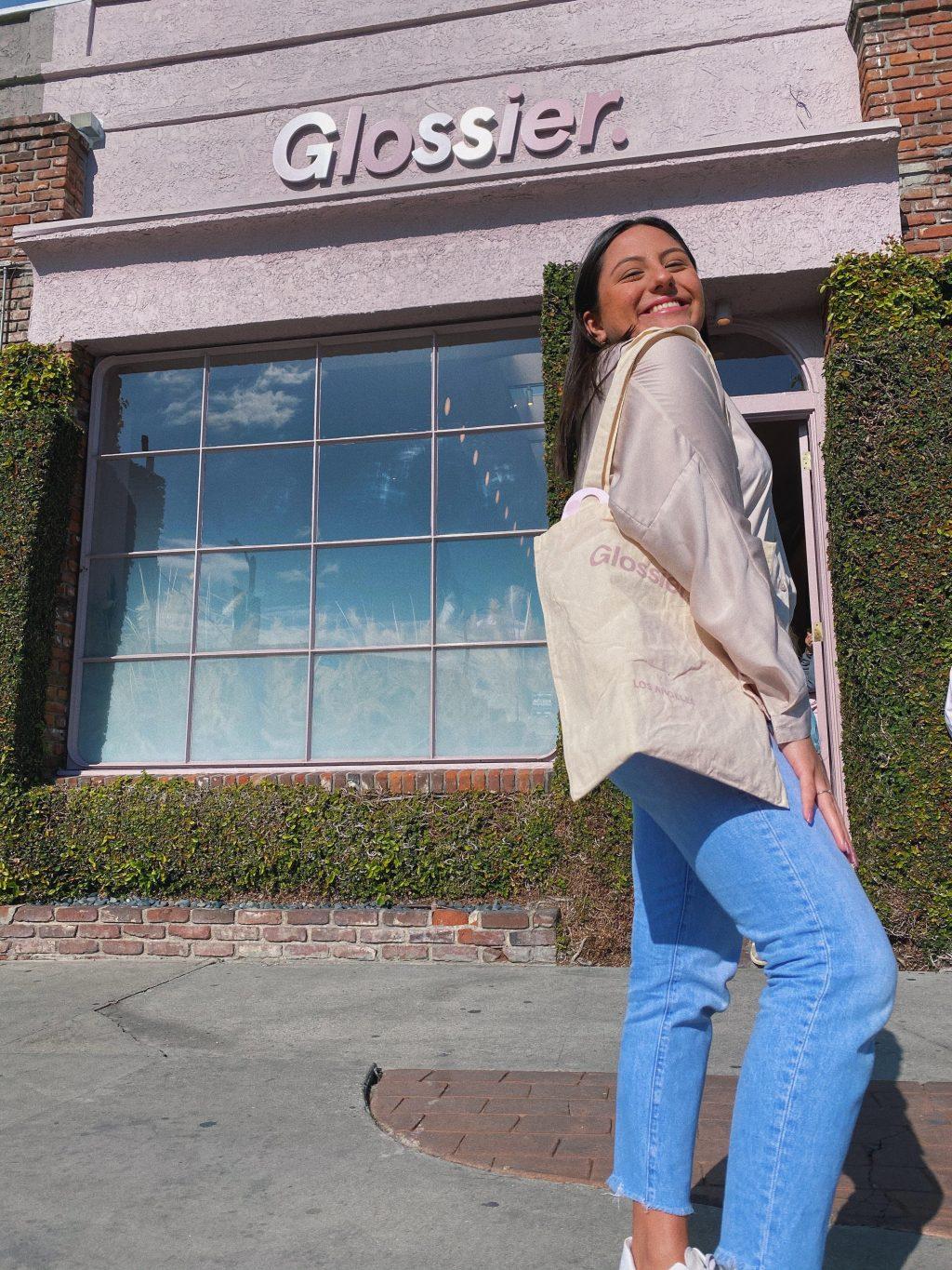 Hurtado pops a knee outside of the Glossier store on Melrose Place, a neighborhood in L.A.