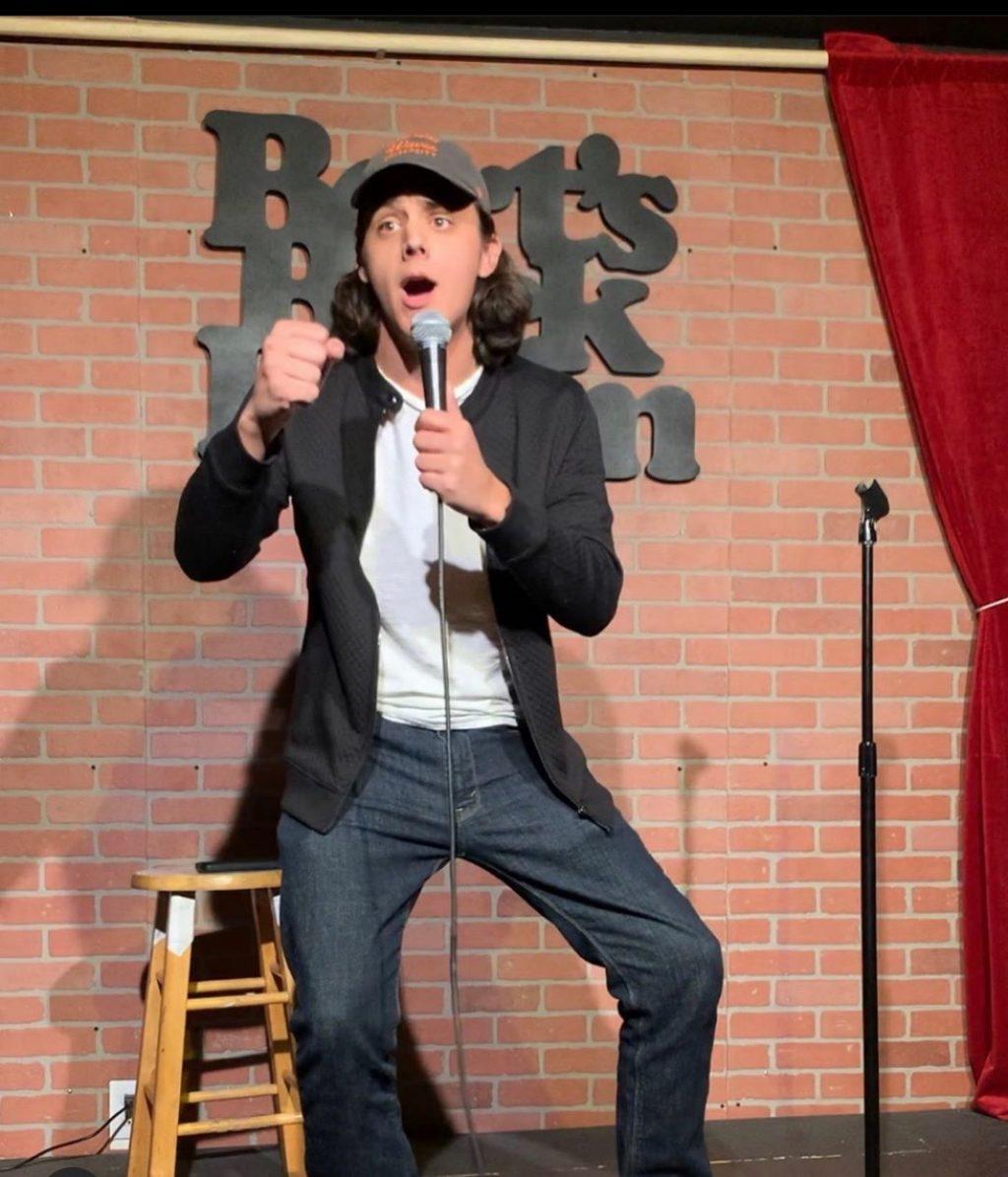 Senior Clayton Mattingly performs stand-up comedy at an open mic night at Bert's Backroom on Melrose Avenue. He has written his own material for his two-year stand-up comedy stint. Photo courtesy of Clayton Mattingly