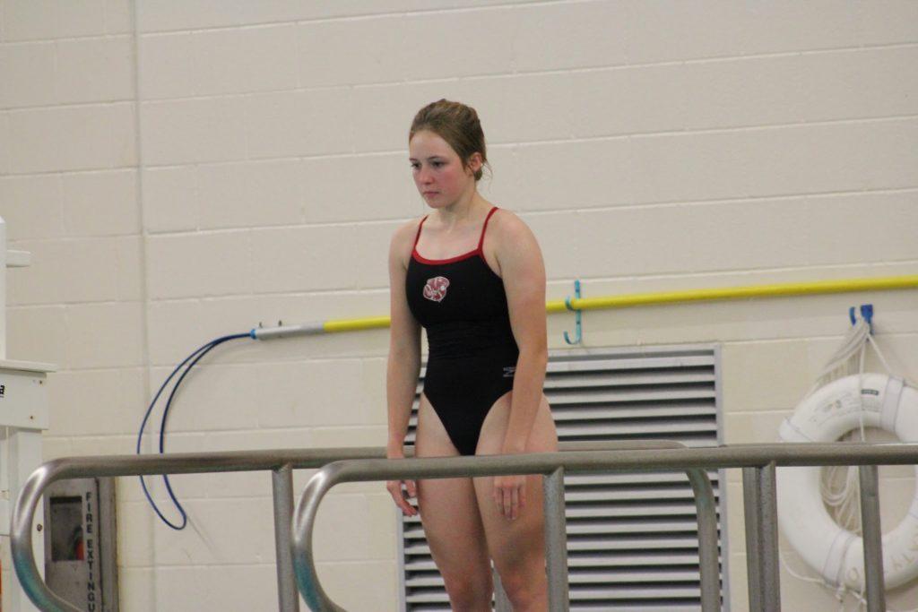 Cannon pauses before diving during the first meet of her senior year in Texas. She began diving her freshman year of high school.