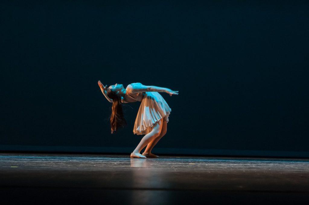 Lee sways back during a dance at her local Orange County theatre. The dancer said she wants to try out for Dance In Flight when the University opens.