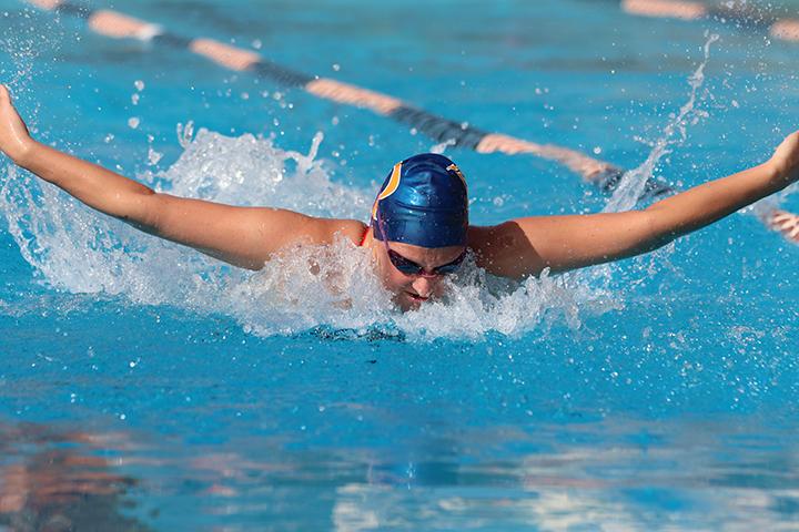 Sophomore swimmer Caroline Anderson competes in a meet last season. Anderson will be among the returning Waves looking to turn over a new leaf under head coach Ellie Monobe. File photo