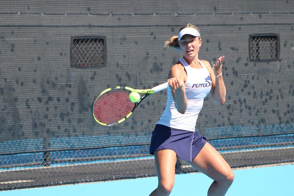 Ashley Lahey strikes a forehand at the Ralphs-Straus Tennis Center. Though Lahey took leave of absence from Pepperdine this semester, she will be back in the spring to compete for a national title in singles and with her team. File photo