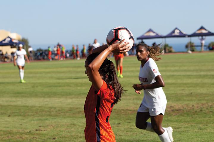 Defender Laura Ishikawa looks to find a teammate for a throw-in during a 2019 victory against eventual national champions Stanford. As of now, no timetable has been released for when the 2020 season will begin. File photo