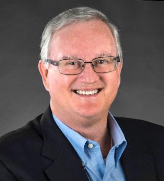 Sport Administration Professor John Watson poses for his faculty photo. Photo courtesy of Pepperdine University