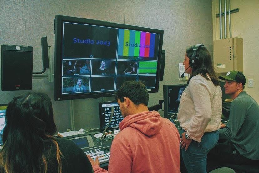 Hurtado views a screen in PLNU&squot;s Point TV Studio. She directed a film in the first-year film show titled "Studio 2043."