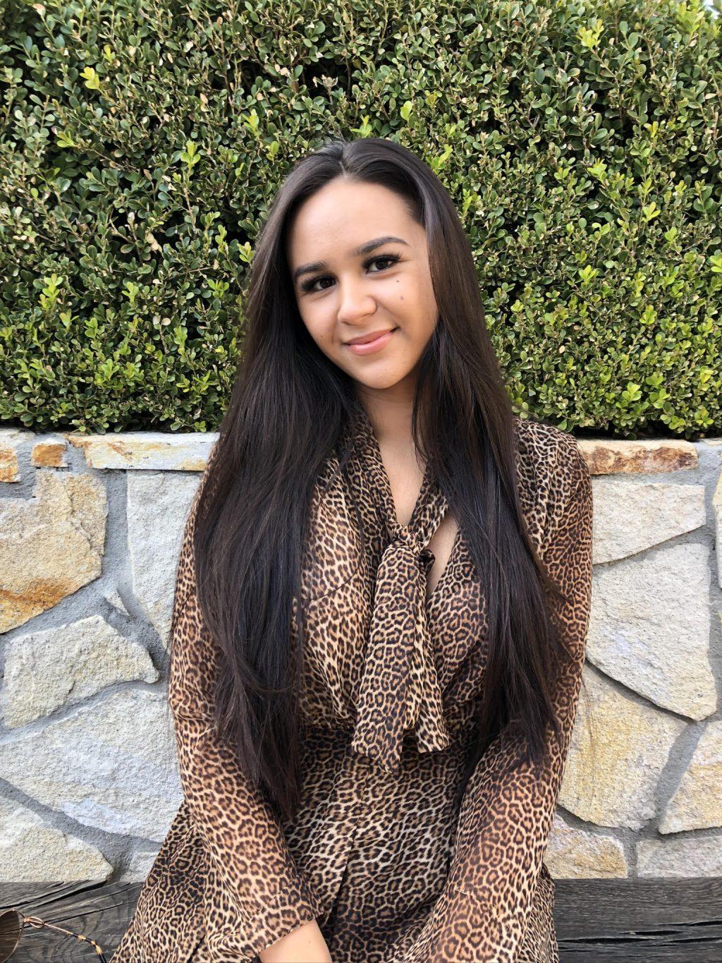 Lifestyle blogger Meghan Macaya flashes a smile in a leopard-print dress earlier this year in Westlake Village. She recently launched her fashion and lifestyle website, Eden, this August. Photo courtesy of Meghan Macaya