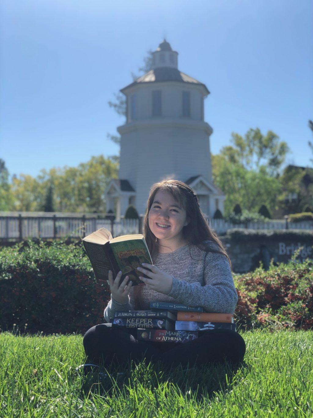 Reader Navia incorporated one of her interests, books, into her senior portraits.