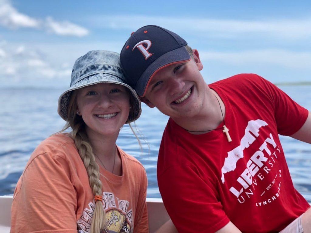 Ganey and his sister Ashley hang out on their grandpa's boat in North Carolina. The first-year represented his university by wearing a Pepperdine hat.