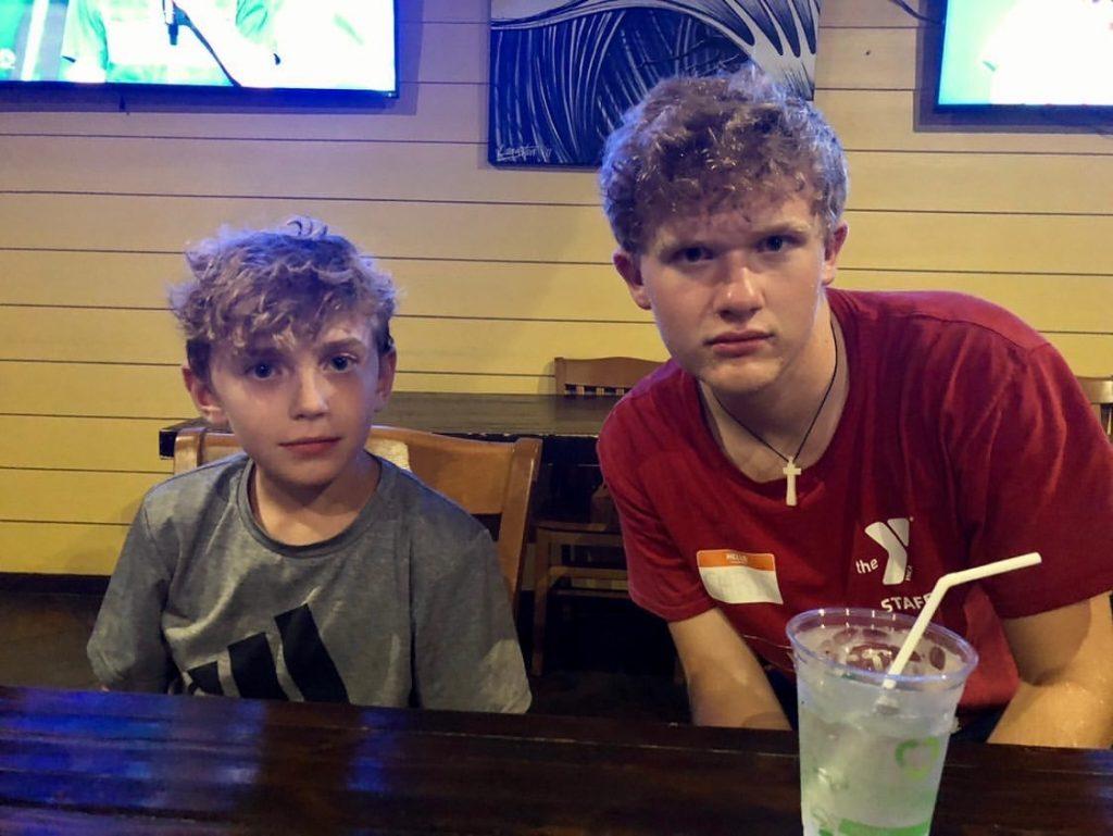 Ganey and his younger cousin Kenny lean in close for a picture at a restaurant in Virginia Beach, Va. Ganey said he intends to get involved with the churches in Malibu by working with kids.
