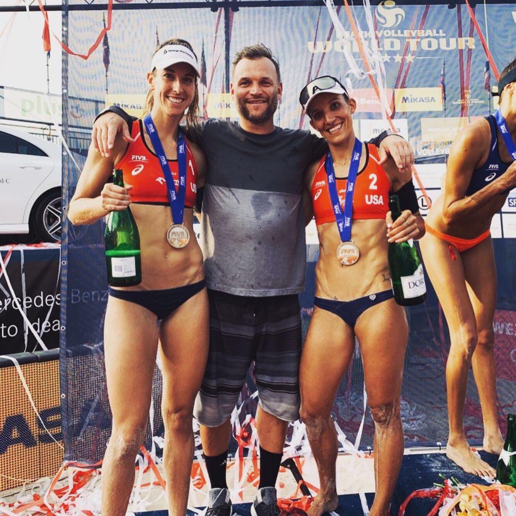 Larsen (left) celebrates a tournament podium on the FIVB tour with teammate Emily Stockman (right). In their two years playing together, Larsen and Stockman have five podiums between AVP and FIVB events. Photo courtesy of Kelley Larsen
