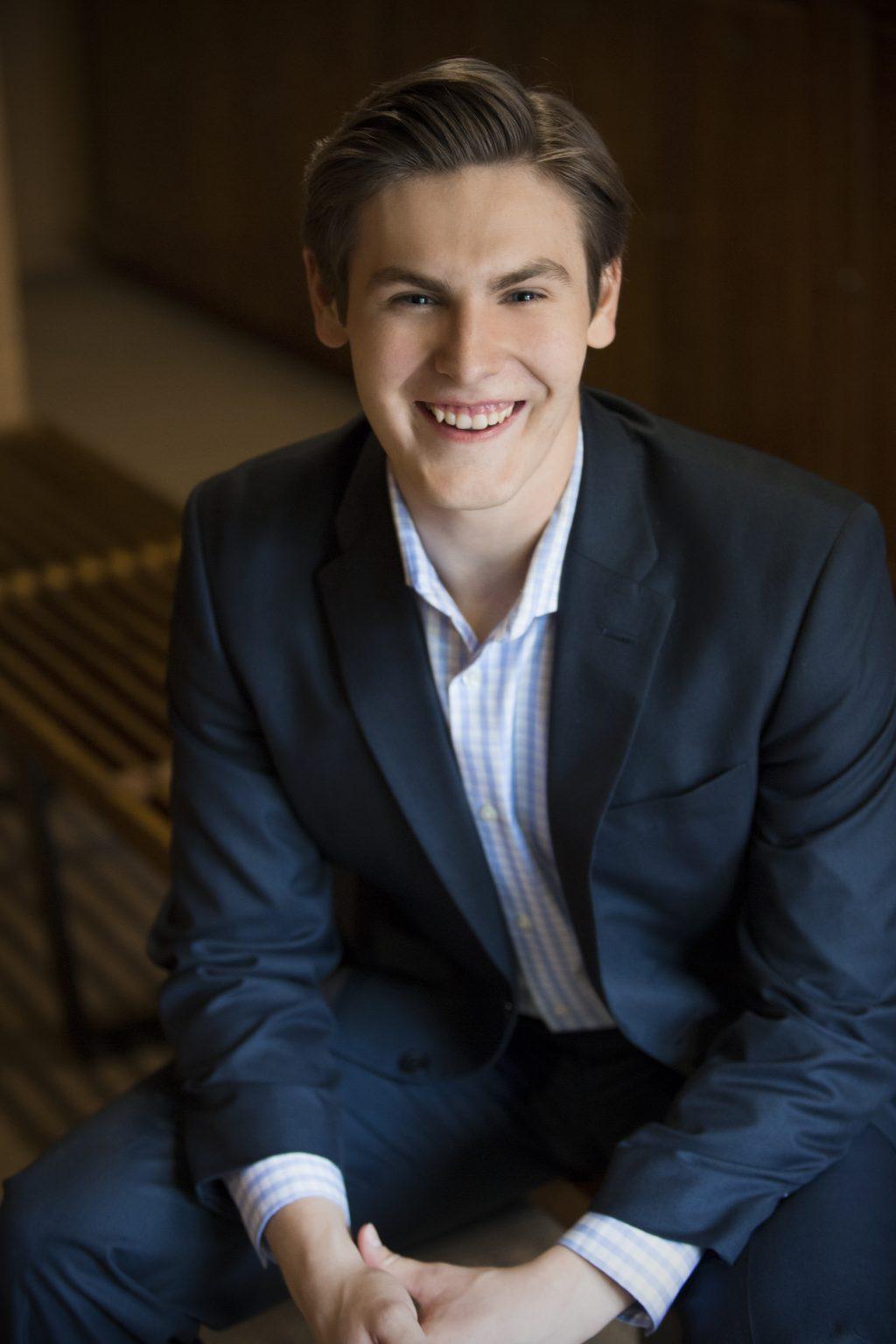 Senior Music major Liam Nixon smiles for a headshot at Taos Opera Institute in New Mexico during the summer. Nixon, a chamber choir singer, said his dream is to sing professionally, travel the world, perform opera in Europe and hopefully end up at the Met. Photo courtesy of Liam Nixon
