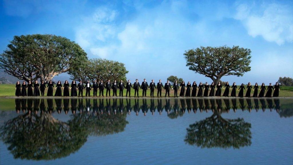 The members of the Chamber Choir hold hands during fall 2019 as they prepare for the official 2020 summer Prague Choral Festival in Prague, Czech Republic. Due to COVID-19, however, the choir was not able to make it this summer, but the singers said they hope to travel and participate in summer 2021. Photo courtesy of Haily Watson