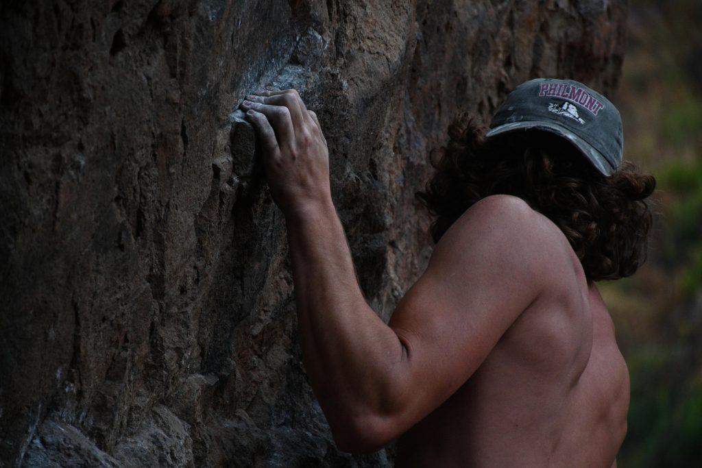 Sophomore John Palmer climbs the Espresso route at Echo Cliffs, California, in the summer of 2020. The climbing club decided to continue operating through the fall 2020 semester. Photo courtesy of Kyla Lucey
