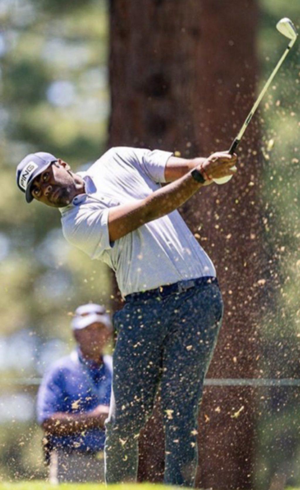 Pro golfer Theegala swings his 9 iron toward the 10th green during the Barracuda Championship on Tahoe Mountain Club's Old Greenwood Course in Truckee, CA. He tied for 41st in the tournament.