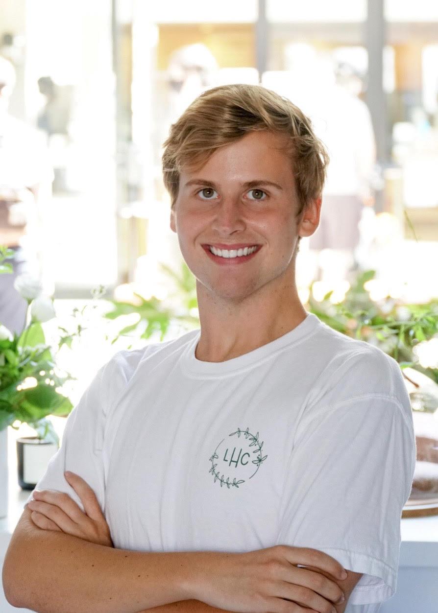 Junior Chase Johnson smiles in Culver City at the Little House Confections pop-up shop. He heard about the bakery from a friend who recommended that he work there. Photo courtesy of Chase Johnson