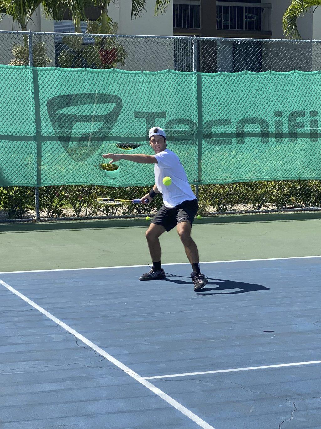 Walk-on freshman Tom Grosjean eyes the ball as he prepares to return the hit to his opponent at Tennium Academy in Delray Beach, Fla. Photo courtesy of Tom Grosjean