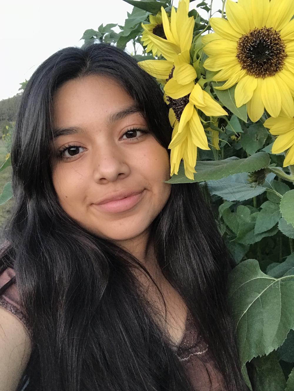 Hurtado poses in a sunflower field on Bear Mountain in Big Bear, CA, in September 2018. Hurtado said as she grew more confident in her writing abilities, she enjoyed taking photos and attending events for yearbook.