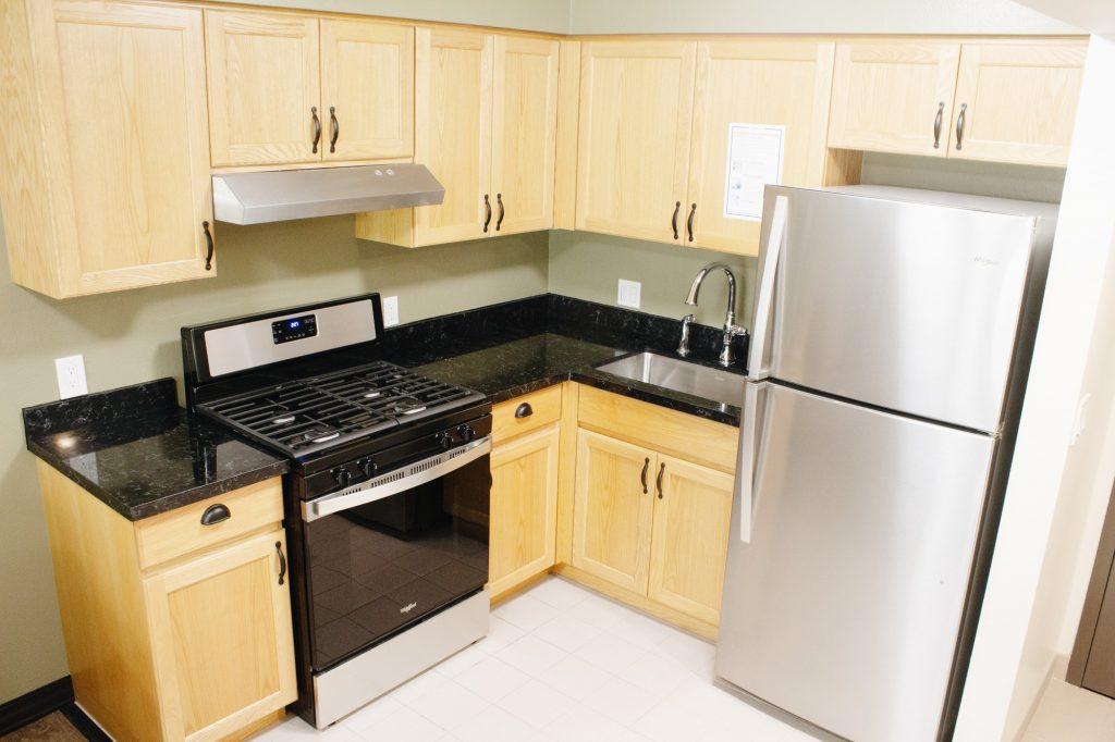 New appliances, cabinets and countertops enhance the updated Lovernich kitchen, photographed Aug. 11. Previously, students complained about old fridges, stoves and countertops.