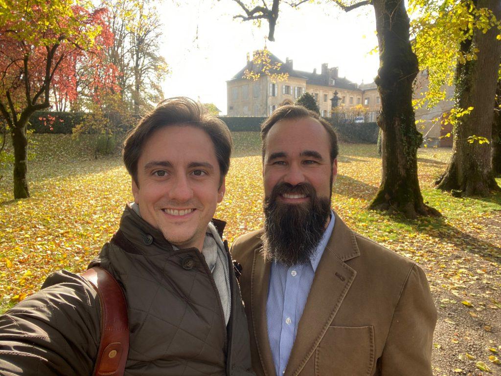 Associate Director Mark Barneche and Plank smile for a photo in front of Chateau d'Hauteville earlier this year. The chateau was built in the mid-1700s and will serve as the the program facility for Lausanne participants as soon as 2023. Photo courtesy of Ezra Plank