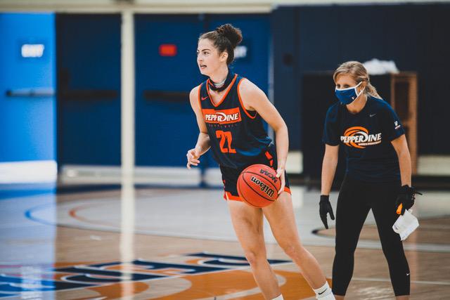 Carson leads a play with direction from Head Coach Kristen Dowling during an Oct. 14 practice in Firestone Fieldhouse. As a senior at Juneau-Douglas High School, Carson averaged 24 points and 8 rebounds per game. Photo courtesy of Pepperdine Athletics