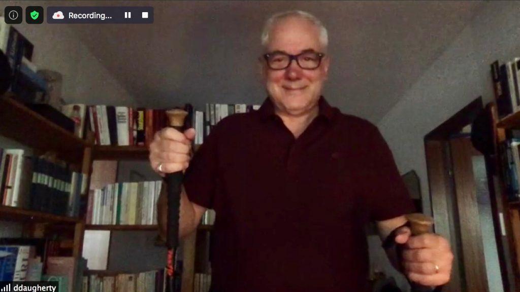 Daugherty shows the poles he uses when he goes on his walks during an interview on Sept. 24. The director said one of the activities he enjoys during the COVID-19 pandemic is walking outdoors. Photo by Emily Shaw