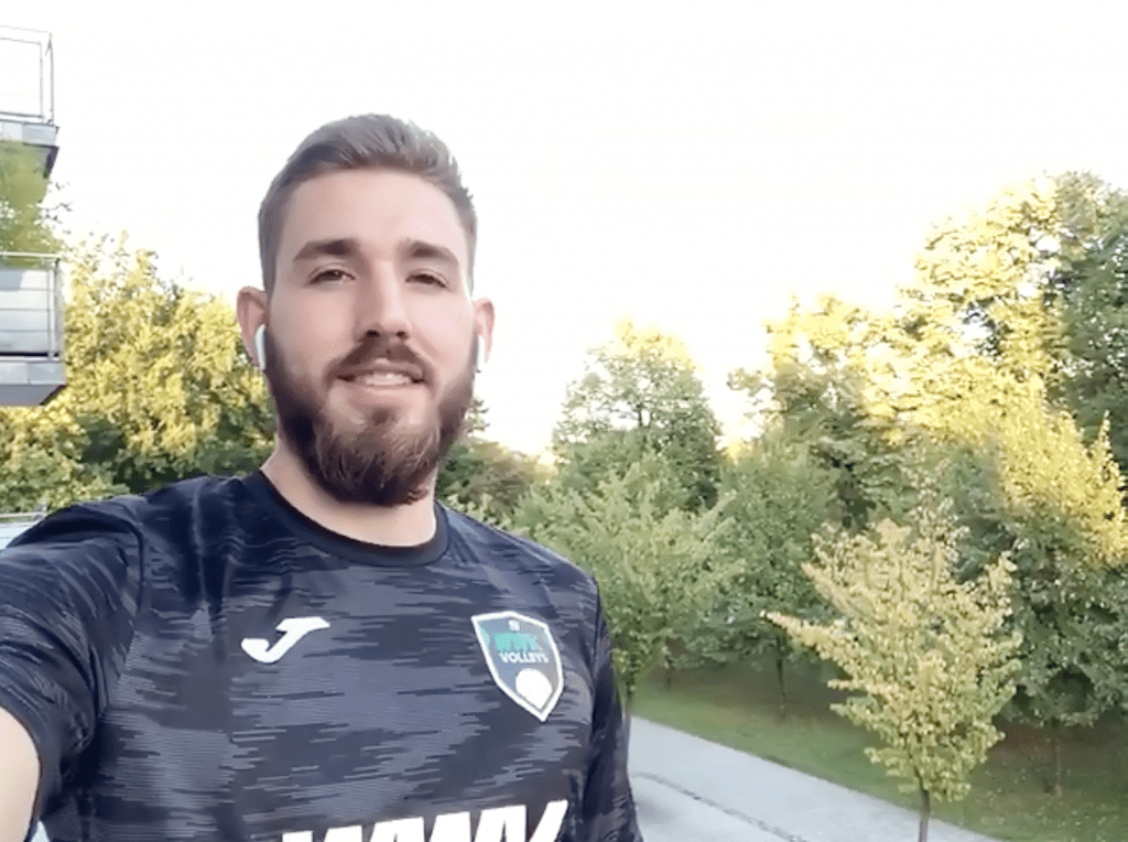 Wieczorek smiles from the balcony of his apartment in Munich, Germany. Wieczorek signed with a new team, the WWK Herrsching Volleys, for the 2020–2021 season. Photo by Ali Levens