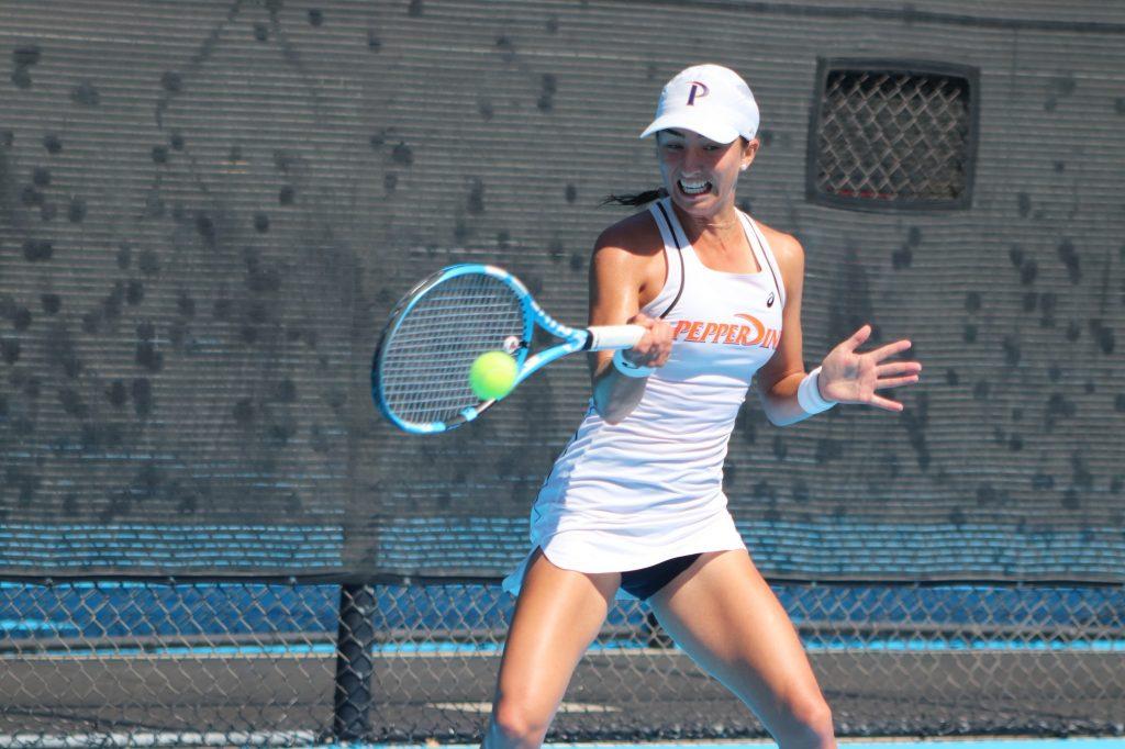 Sixth-year senior Jessica Failla swings through for a return while playing in a semifinal match Oct. 5, 2019. Failla competed in a few tournaments this past summer. Photo by Ali Levens