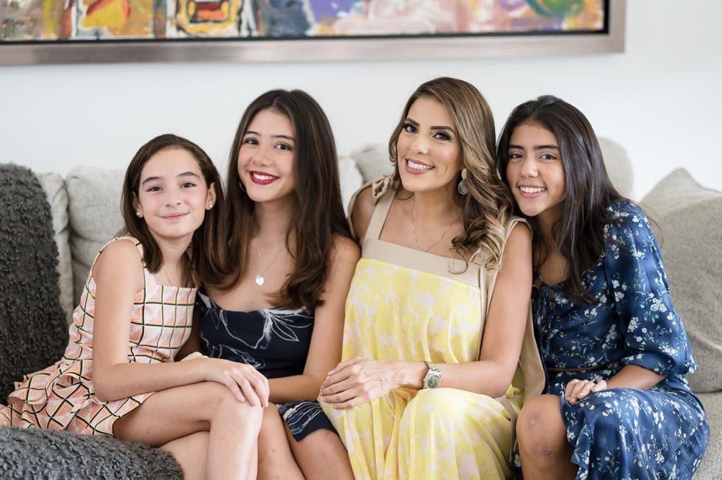 Cerna (second from left) poses with her two sisters, Ivanna and Sofía, and mother Ivania for a family portrait in October. Cerna was a part of many service organizations during high school.