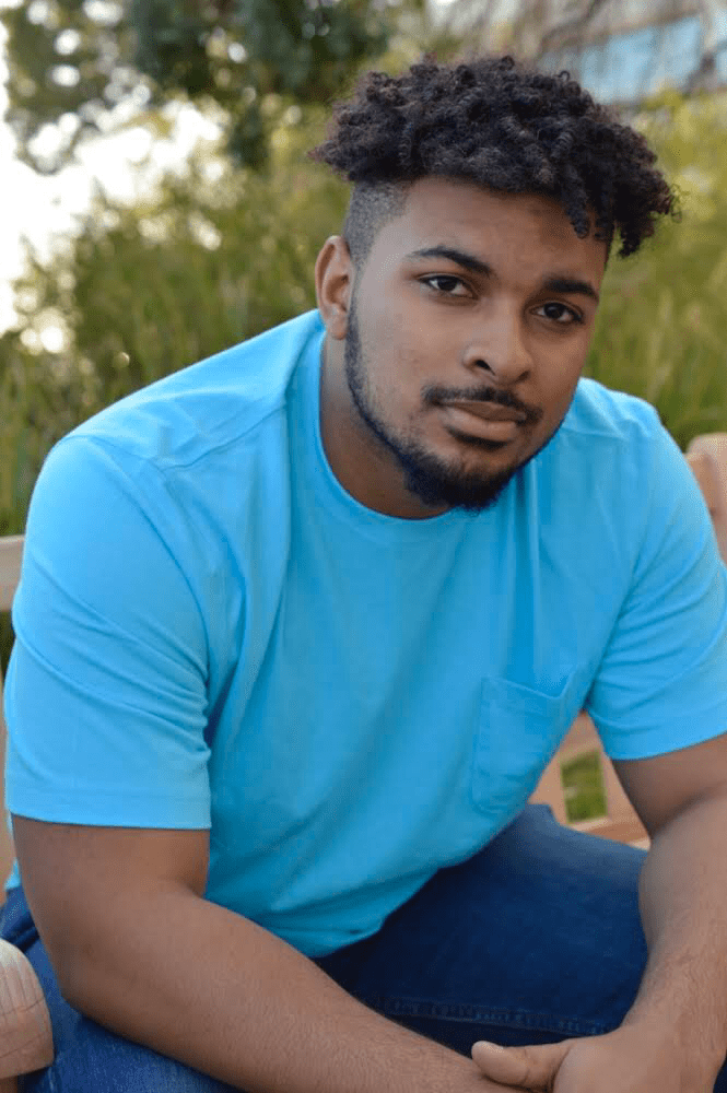 Senior George Preston IV personifies Jaquan Wallace in his headshot for "Polar Bears, Black Boys & Prairie Fringed Orchids." Jaquan, a gay BLM activist who lives in Harlem, New York, discussed that being Black is also about living and facing discrimination among fighting and giving talking points.