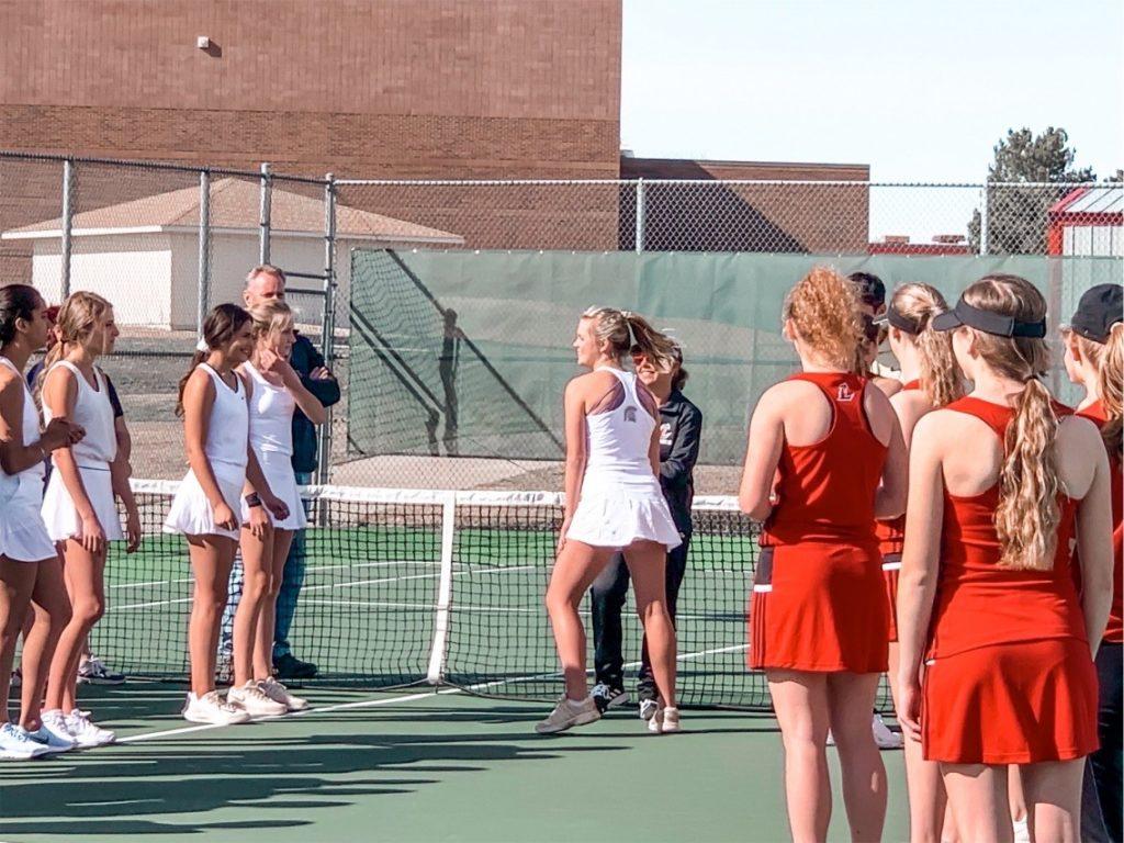 Cullen and her Greeley West High School tennis team (in white) participate in lineups in March. Cullen said even though their season was cut short, as captain, she did everything she could to make everyone feel included.