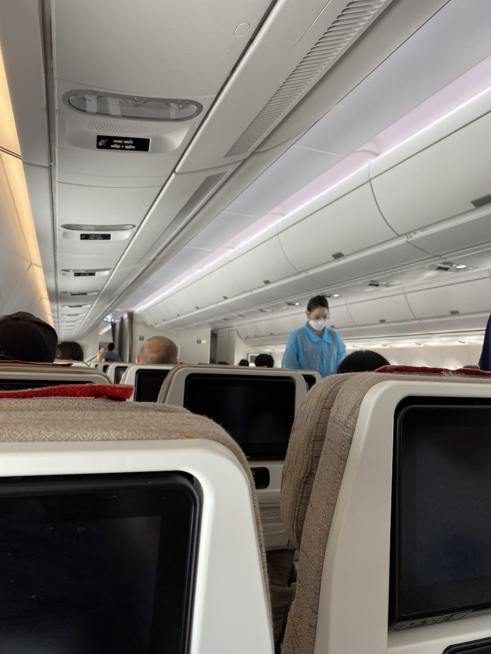 Flight attendants ensure passengers properly prepare for take-off. The biggest difference between this flight and pre-COVID-19 flights was the use of personal protective equipment.