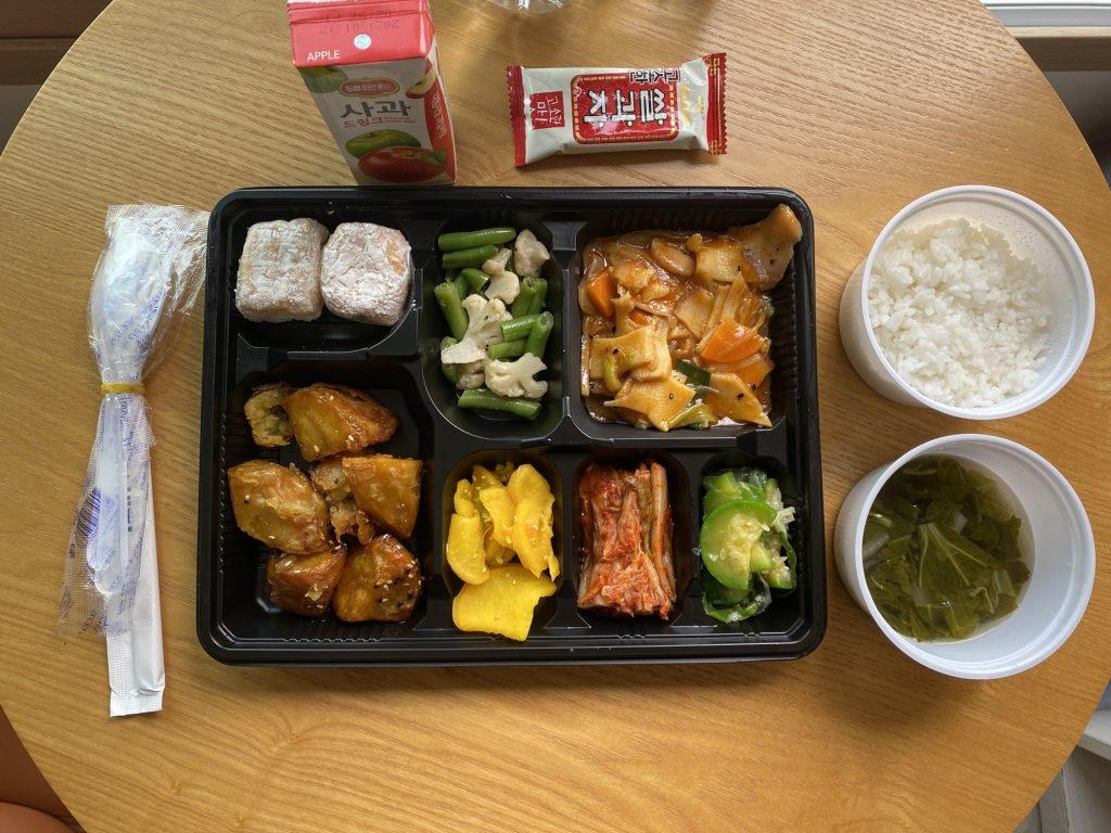 Each hotel-provided quarantine meal includes a side-dish tray, bowls of rice and soup, a snack and a beverage. I disposed of each meal in the plastic bag it came in, then placed the three plastic bags in a large biohazard bag and finally placed the biohazard bag outside my door before 7 p.m. each day.