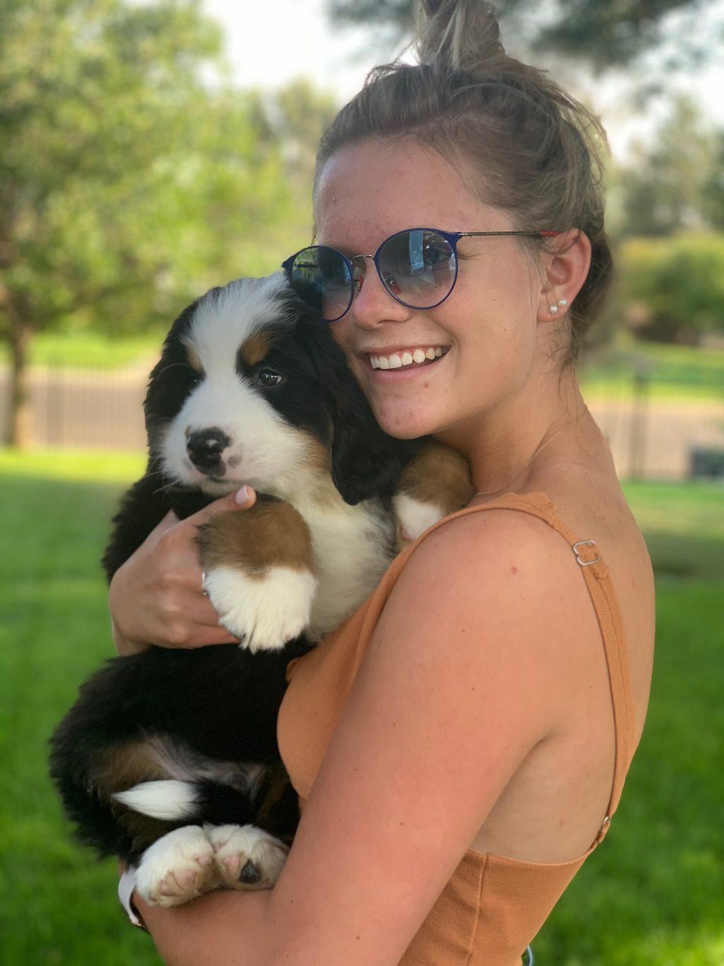 Cullen smiles as she snuggles her parents' puppy, Kroner, in August before she moved out to California. Cullen said she loves California, especially because it doesn't snow.