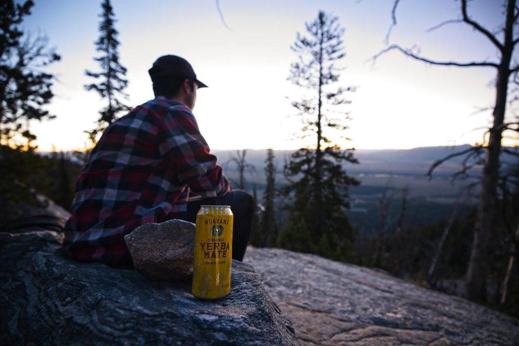 Erbes gazes at the view from Delta Lake under the Grand Teton in Jackson, Wyo., while he sips Guayaki Herba Mate in September. Erbes said Guayaki's mission is to share the cultural and social implications of the sacred South American drink. Photo courtesy of Jacob Erbes