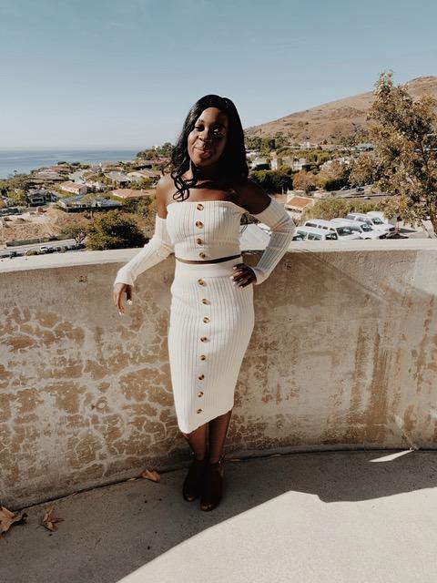Senior Rachel Melomey poses in a white two-piece set at Pepperdine last September after attending an initiation ceremony for her sorority, Gamma Phi Beta. Melomey said her favorite fall trends are neutral pieces and matching sweat sets. Photo courtesy of Rachel Melomey