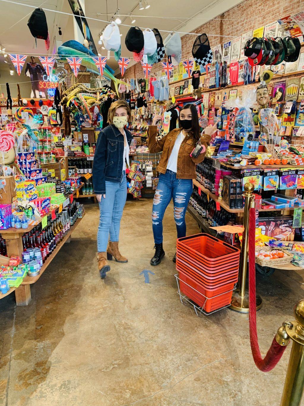 First-year Isabella Joiner (left) and her roommate Stephanie get hyped after finding a Rocket Fizz in downtown Ventura on Sept. 11. Joiner enrolled in online community college classes for the fall but moved to Southern California for the Pepperdine friendships. Photo courtesy of Isabella Joiner