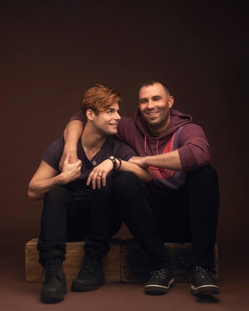 Knight and Clayton smile at each other for a photo taken by Luke Fontana in early 2018. After dating for almost eight years, Knight said this was one of the couple's first shoots after coming out.