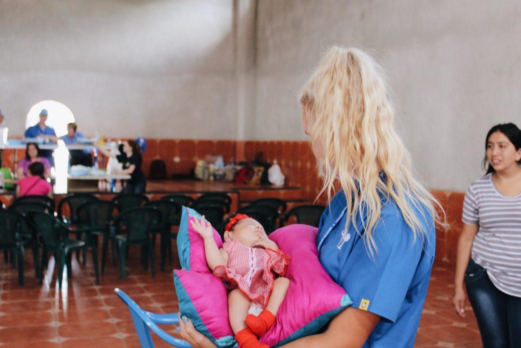Wisniewski cradles a child during her trip to Honduras as a medical brigade volunteer in 2017. She participated in this program for three years in a row through Mission UpReach, a humanitarian relief organization.