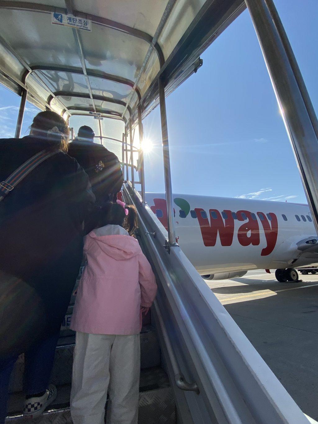 Passengers walk up the stairs to board a T'Way flight from Busan's Gimhae International Airport to Seoul's Gimpo International Airport on Oct. 12. The flight took one hour, and I was able to take the metro directly back to my place of stay.