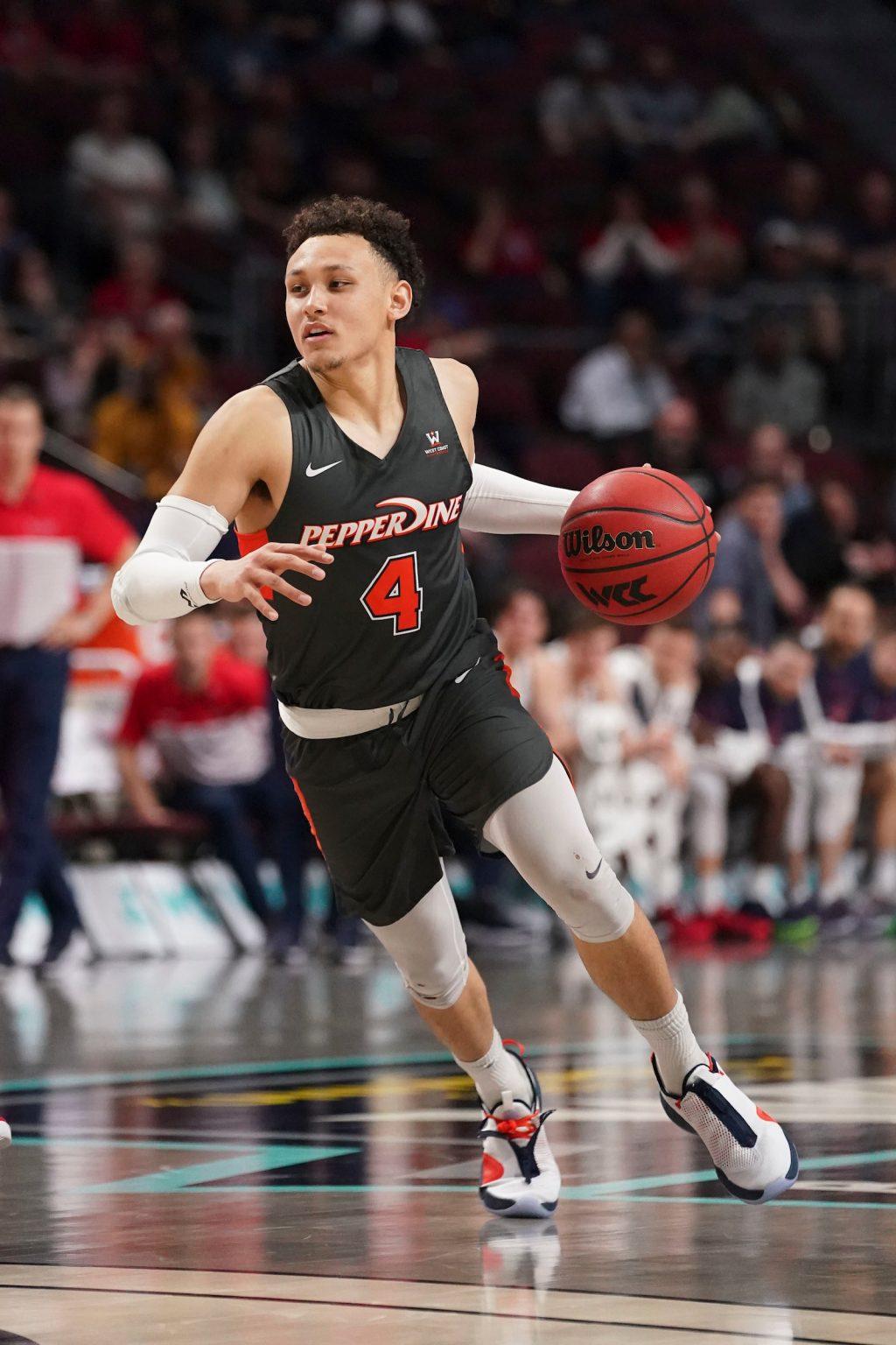 Senior guard Colbey Ross drives into the lane during the first overtime of the WCC quarterfinal game against Saint Mary's University on March 7. Despite an astounding 43 points from Ross, the Waves lost 89-82 in double overtime. Photo courtesy of Kyle Terada