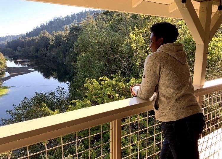 Alone with his thoughts on a fall retreat, Miles looks over Russian River in Santa Rosa, CA, in November 2019. In Miles' high school, every senior went on a retreat to understand themselves on a deeper level.