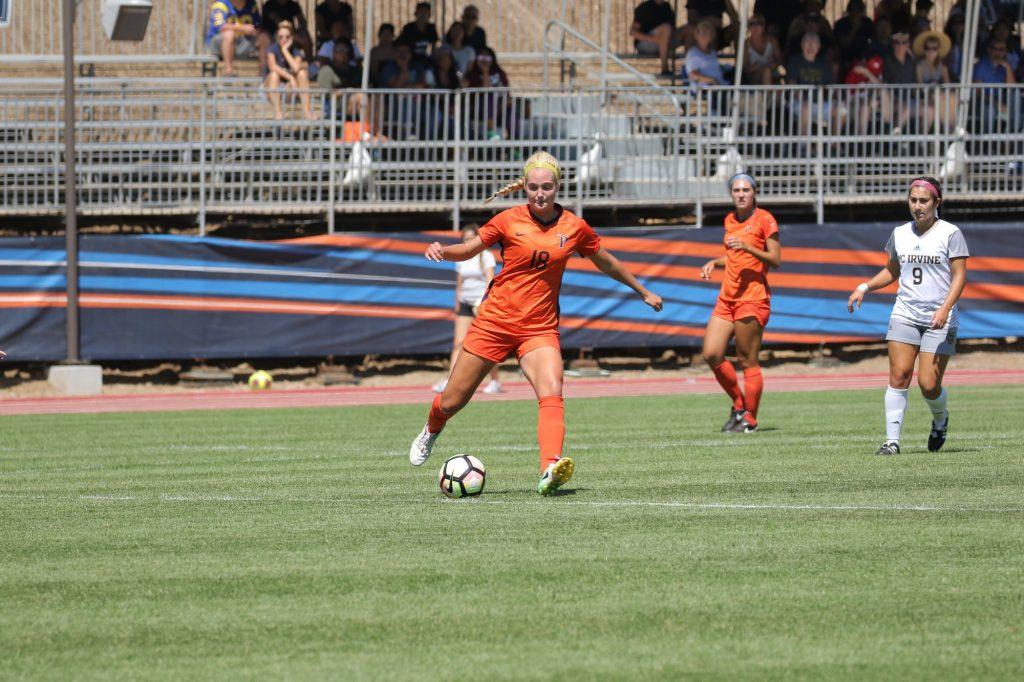 Senior defender Emily Sample boots the ball in a Sept. 16, 2018, game against UC Irvine. The Waves won the match 2–0.