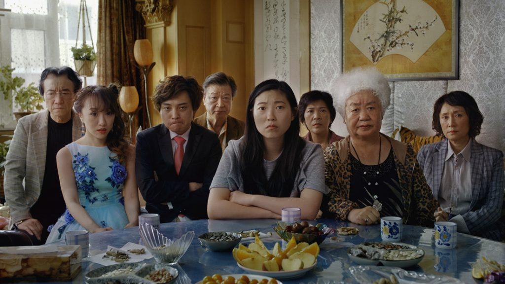 Everyone gathers around the dinner table to hear Nai Nai read her medical diagnosis out loud. Nai Nai, the family matriarch, went to the hospital for a check-up. Photo courtesy of A24