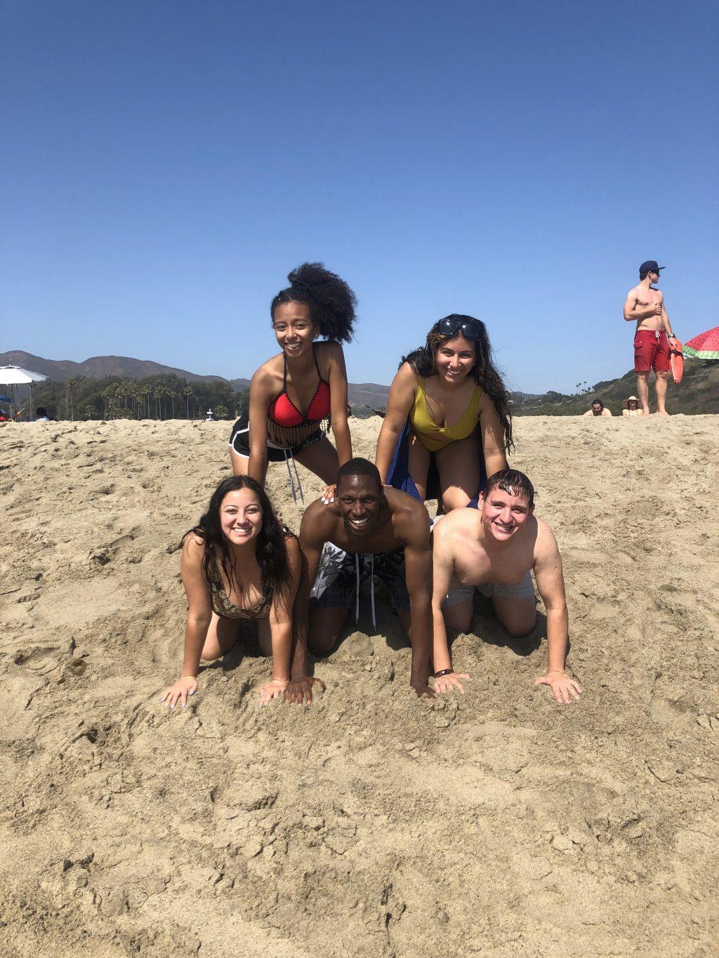 Latino/a/x Student Alliance members bond during the LSA beach day last February (From top left clockwise, Olivia Robinson, Prisiclla Merlo, Juan Carlos Hueges, Payton Silket and Katrina Valenzuela). The LSA hosted many events throughout the year and hopes to translate some of these events online. Photo courtesy of Isabella Mendoza