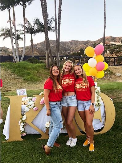 Senior Thetas Ally Richards, Shaeli Funk and Catt Ott (left to right) prepare for the 2019 Meet the Chapters event on the Pepperdine Intramural Field. Panhellenic Recruitment events shifted to an online format this semester, which led to a reduced number of potential new members attending Recruitment. Photo courtesy of Ally Richards