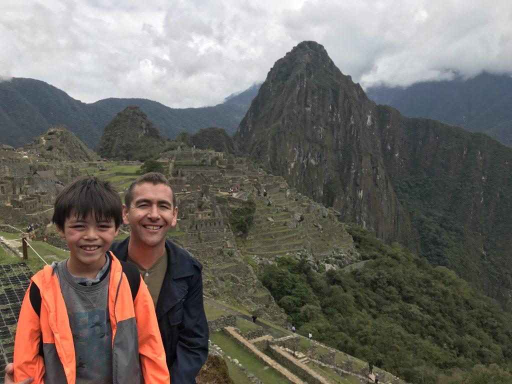 Swarts smiles with Shosuke at Machu Picchu during the fall 2020 International Study Tour to Peru. Swarts said canceling this summer's trips with his family was hard because he loves to travel.